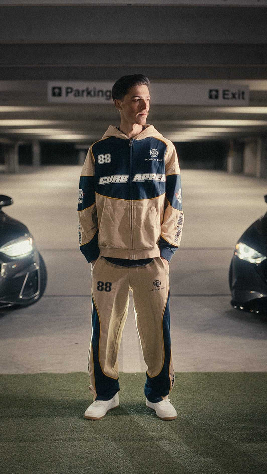 Motorsport Set modeled in parking garage, showcasing Curb Appeal streetwear style.