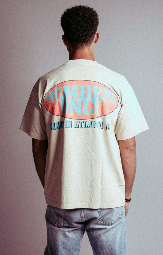 Members Only tee with bold graphic design, modeled by a person standing, featuring "Members Only" back hit, crafted in Atlanta.