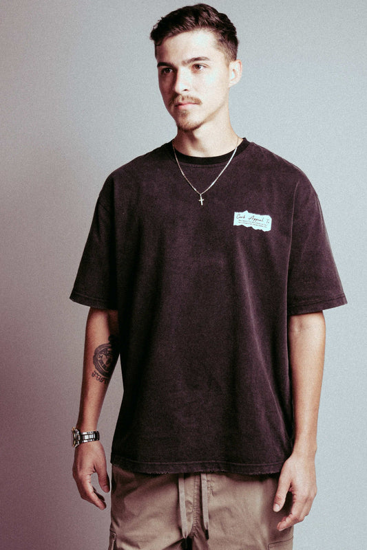 Pablo Racing Tee featuring a casual loose fit, dark color, and short sleeves.