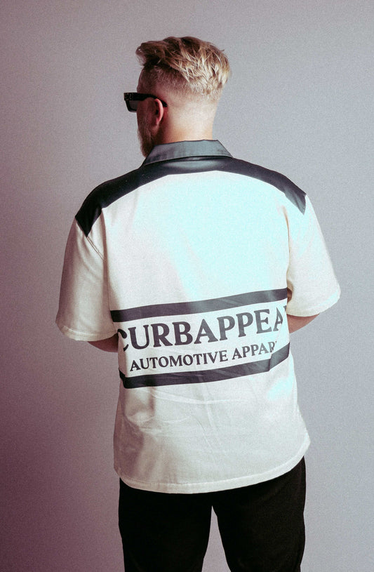 Motion Club Polo in cotton-silk blend with bold back design, limited edition.