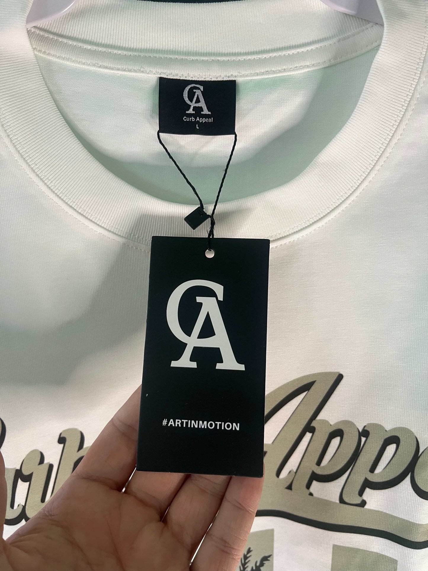 Donk Tee with urban elegance print, 100% soft cotton, unisex fit, black or white.