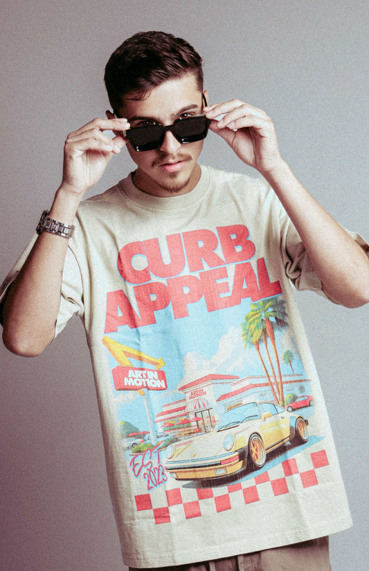 Man wearing In & Out Porsche Tee with graphic front and sunglasses.