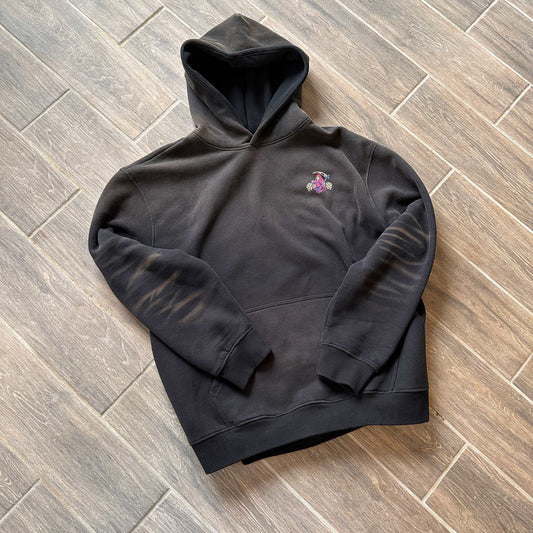 Widow Maker Hoodie with heavyweight comfort and street-certified silhouette on wooden floor.