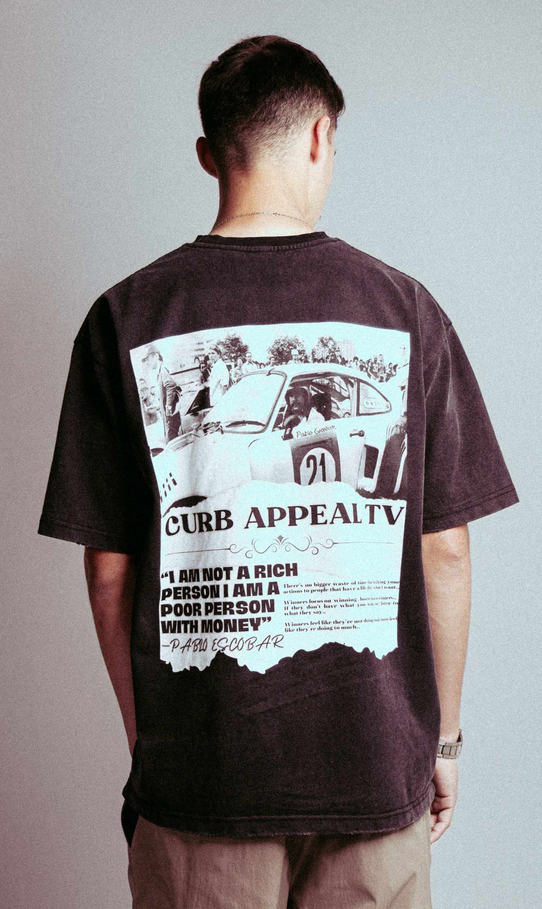 Pablo Racing Tee with vintage car graphic and quote on back.