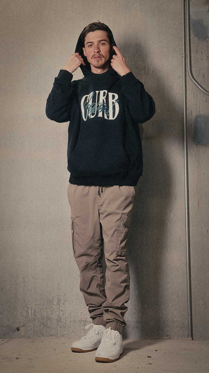 Soft high neck hoodie in black, featuring "Curb" print, modeled for warmth and style.