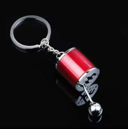 Shifter keychain with realistic mini gear shifter design in premium alloy.