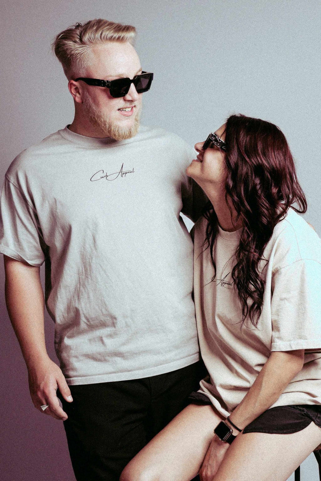 Porsche Tee inspired by RWB design, worn by a couple, lightweight cotton, streetwear style.