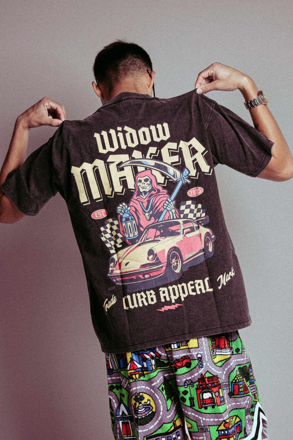 Back view of "Widow Maker Tee" featuring bold graphic design and car illustration for car enthusiasts.