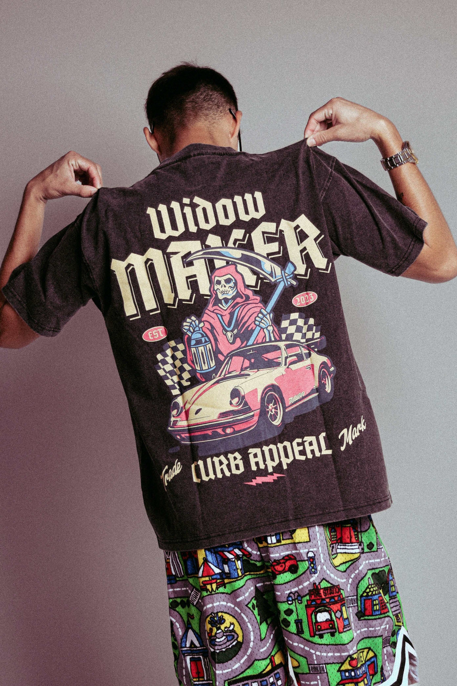 Back view of "Widow Maker Tee" featuring bold graphic design and car illustration for car enthusiasts.