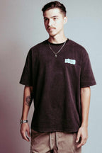 Pablo Racing Tee featuring a casual loose fit, dark color, and short sleeves.