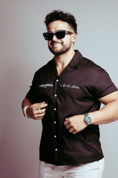 Man wearing High Roller Shades with polarized lenses and glossy frames.