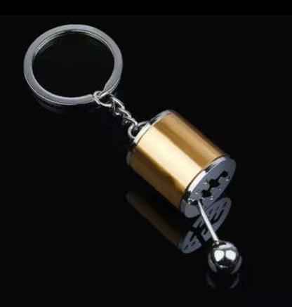 Shifter keychain in premium alloy with realistic mini gear design.