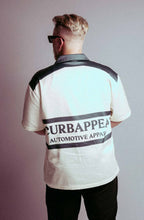 Motion Club Polo in cotton-silk blend with bold back design, limited edition.