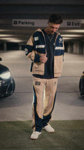 Motorsport set featuring a zip-up hoodie and joggers, modeled in a relaxed fit.