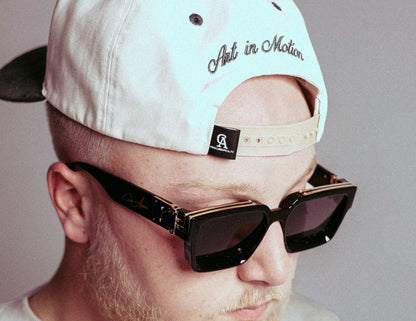 Polarized High Roller Shades with glossy frames and gold detailing.