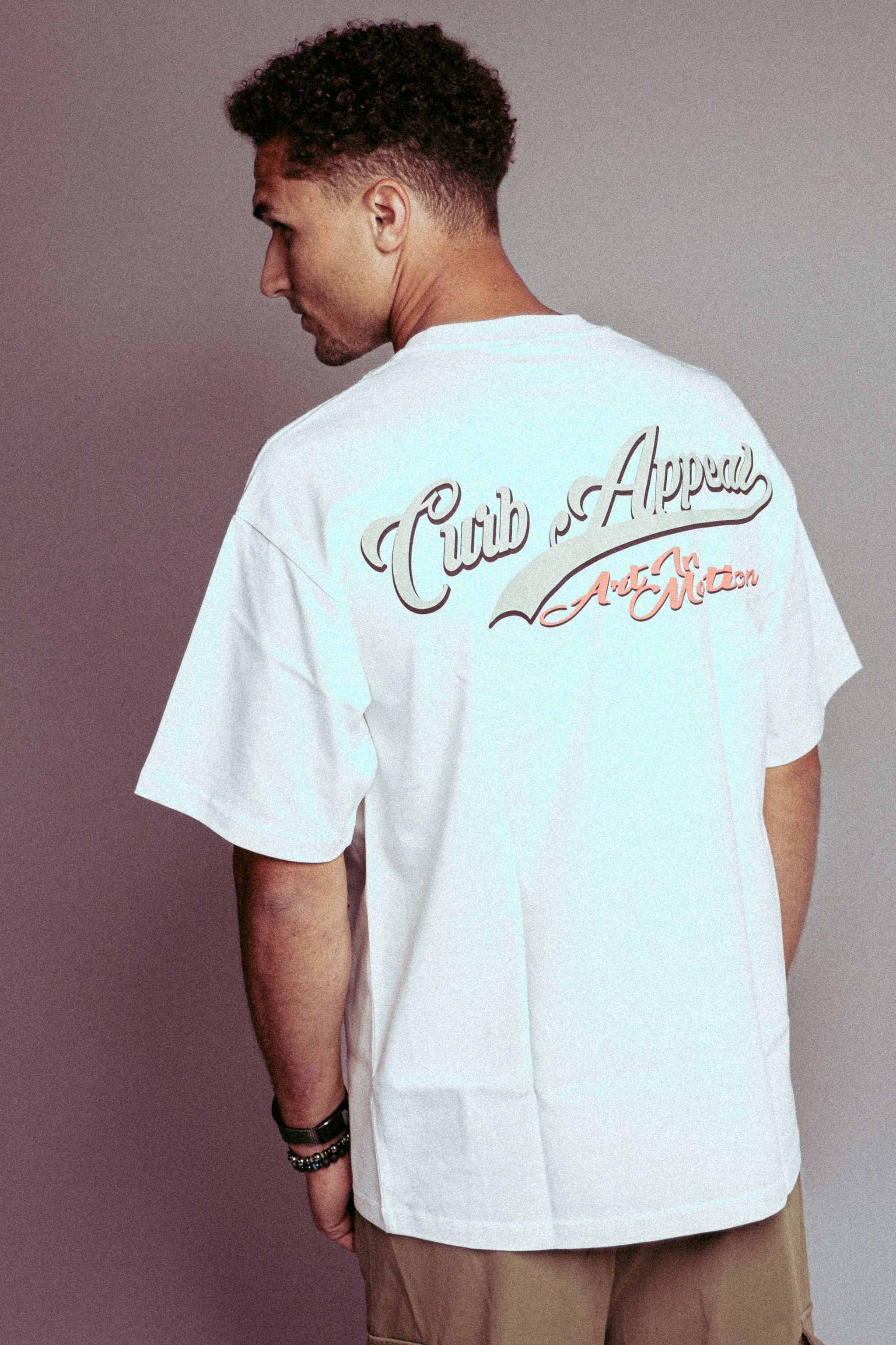 Urban style Donk Tee with bold graphic design and relaxed unisex fit.