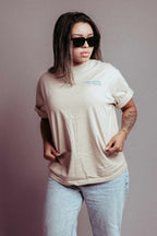 Billion Dollar Man Tee on woman with sunglasses, casual style.