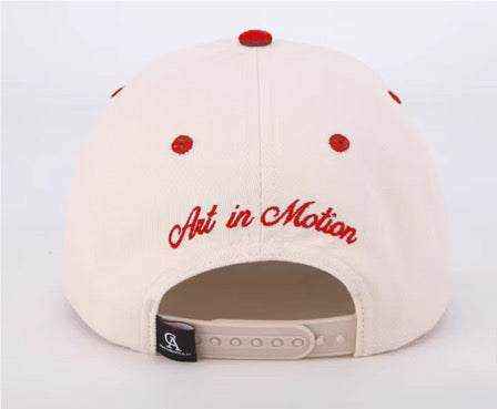 The Winner's Circle Hat with intricate red embroidery and suede bill inspired by racing culture.