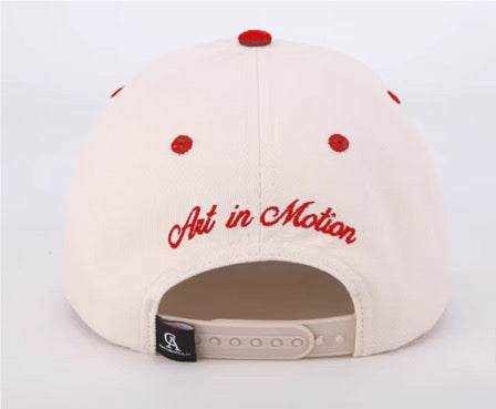 The Winner's Circle Hat with intricate red embroidery and suede bill inspired by racing culture.
