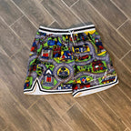 Nostalgia mesh shorts with all-over car mat print on wooden floor.