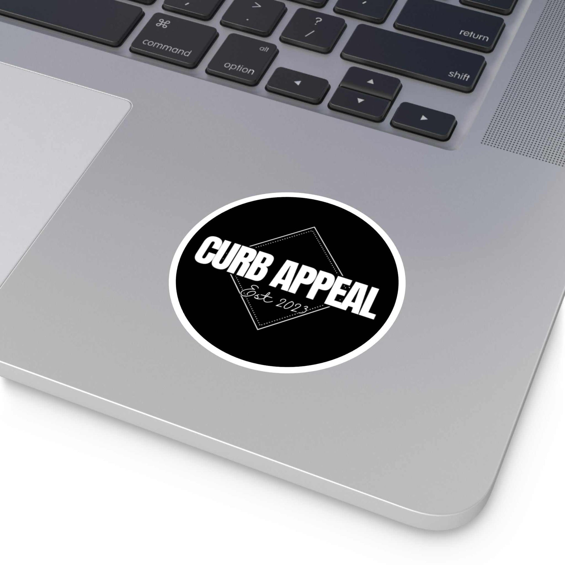 Logo sticker on laptop with "Curb Appeal" design, high-quality vinyl, weatherproof and UV-resistant.