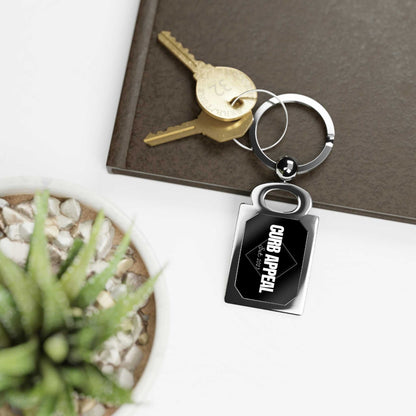 Sleek Logo Keychain with polished emblem, durable build, and compact design.