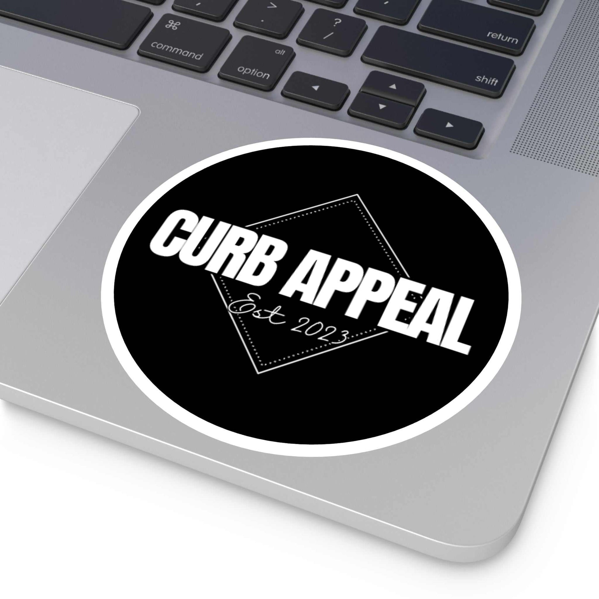 High-quality Curb Appeal logo sticker on laptop, black and white, UV-resistant and weatherproof.